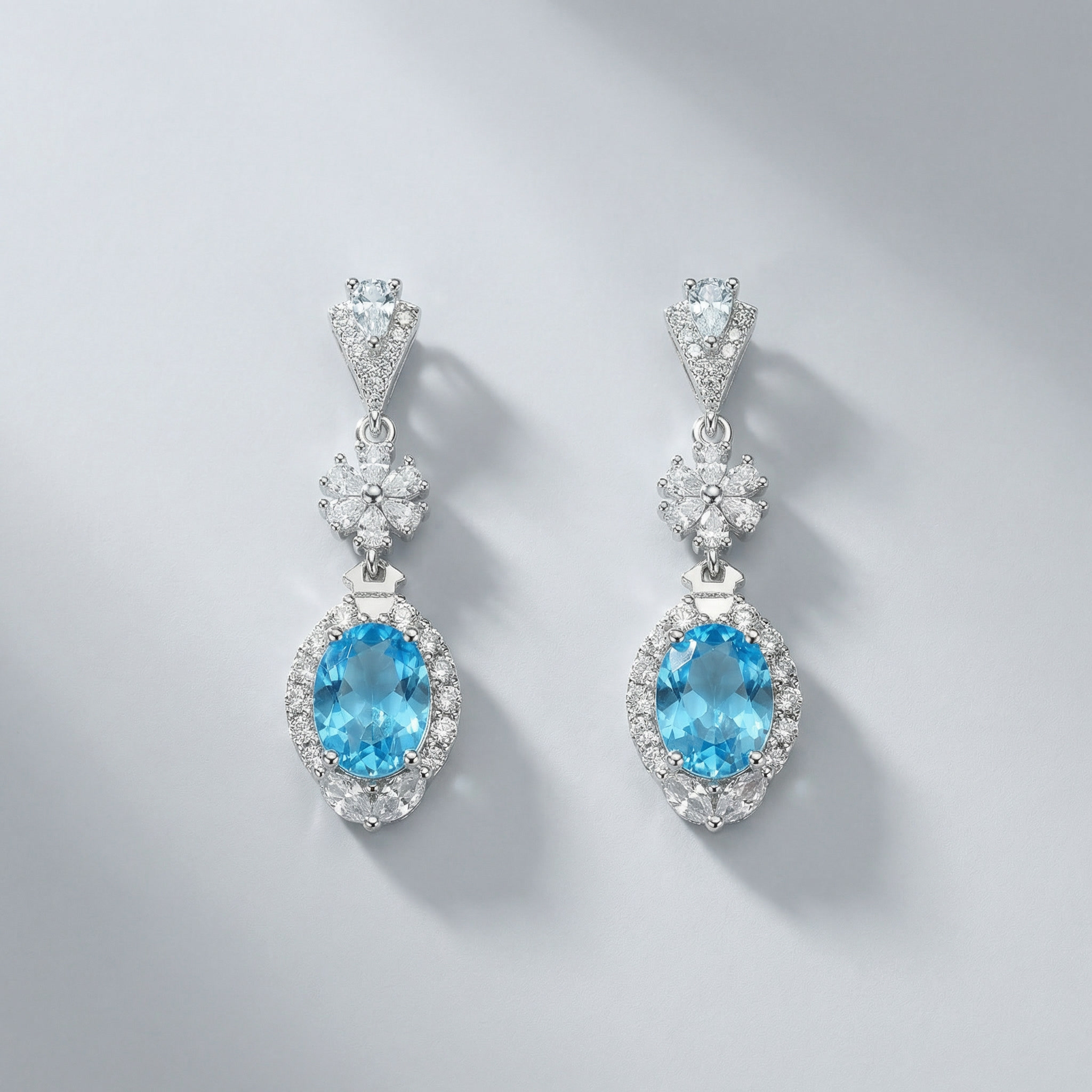 azure halo elegance drops – platinum plated oval blue zircon earrings
