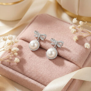 lumibow pearl radiance drop earrings – platinum plated bowknot with zircon halo