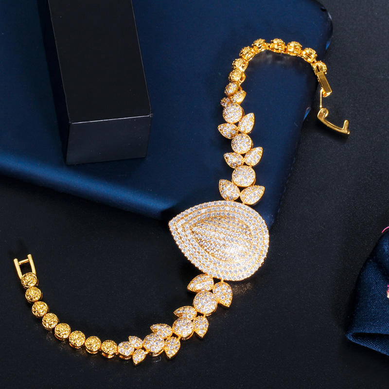 royal dewdrop radiance – 18k gold plated cz leaf charm statement bracelet royal dewdrop radiance – 18k gold plated cz leaf charm statement bracelet