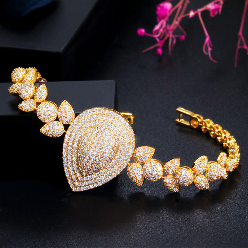 royal dewdrop radiance – 18k gold plated cz leaf charm statement bracelet royal dewdrop radiance – 18k gold plated cz leaf charm statement bracelet